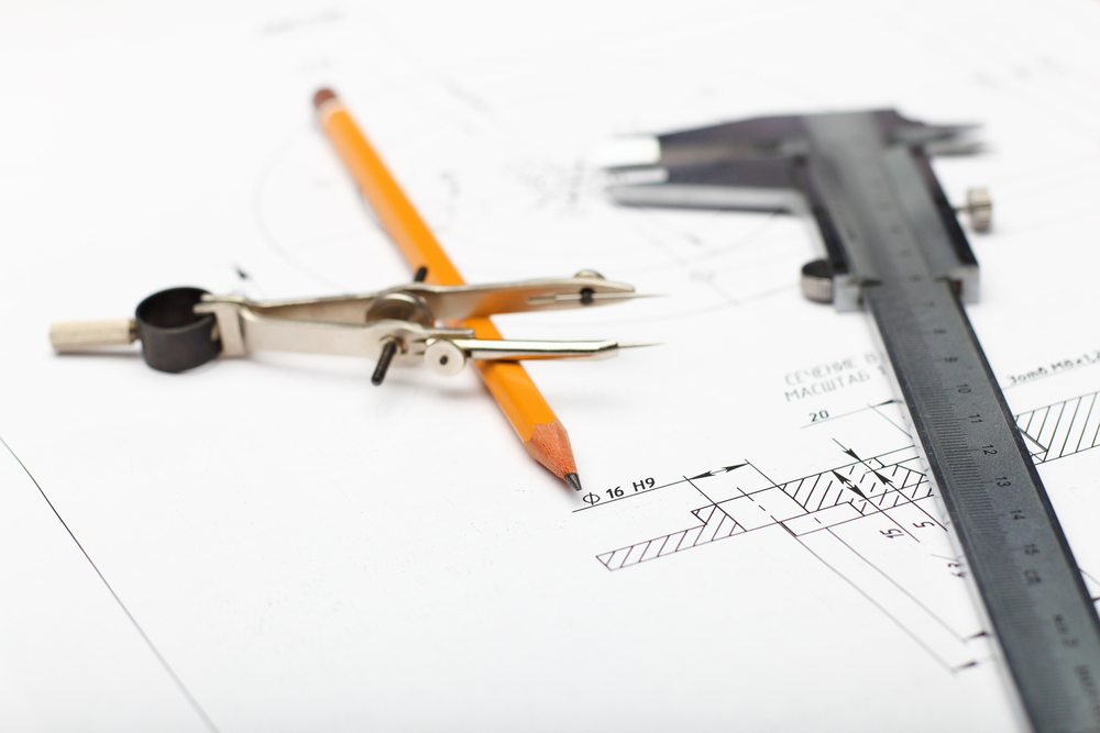 Tools and papers with sketches on the table