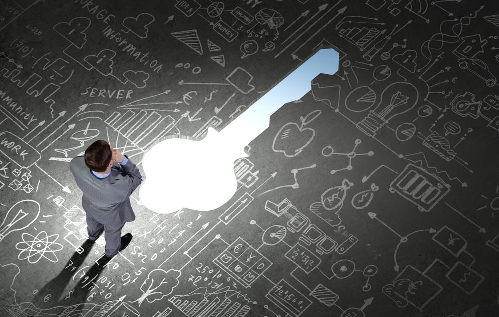 Top view of businessman looking at business sketches on floor