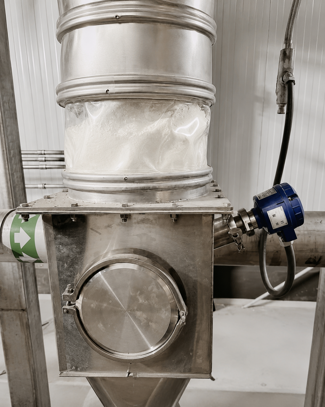 Bulk material bridging inside an industrial hopper